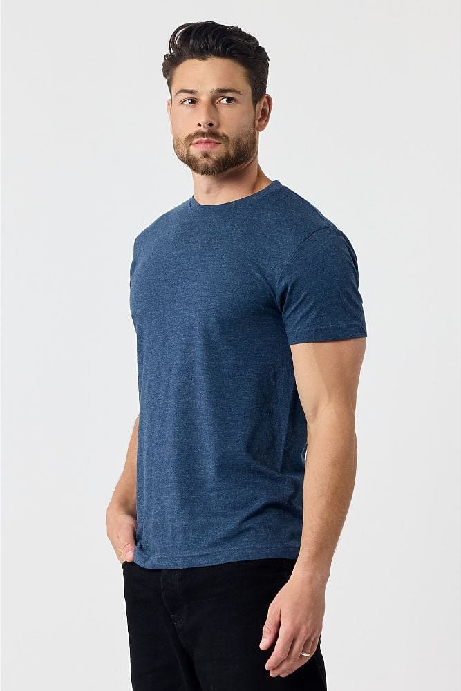 A man in the 501 adult everyday tee in heathered navy, three-quarter view