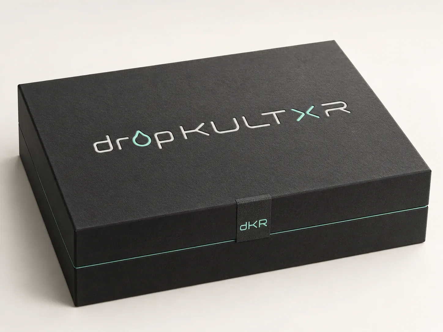 Concept packaging: a closed black box with a mint band and a tonal dropKULTXR wordmark